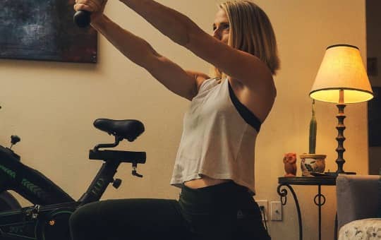 woman working out with healthy gut microbiome