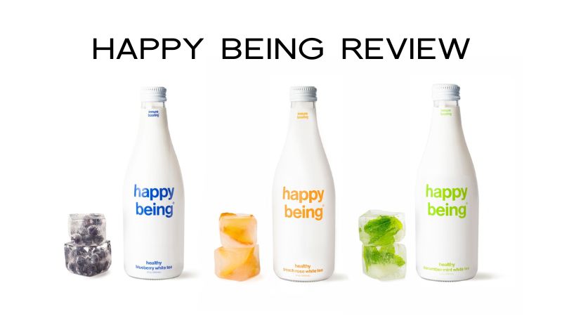 Frozen versions of Happy Being tea next to bottles of happy being